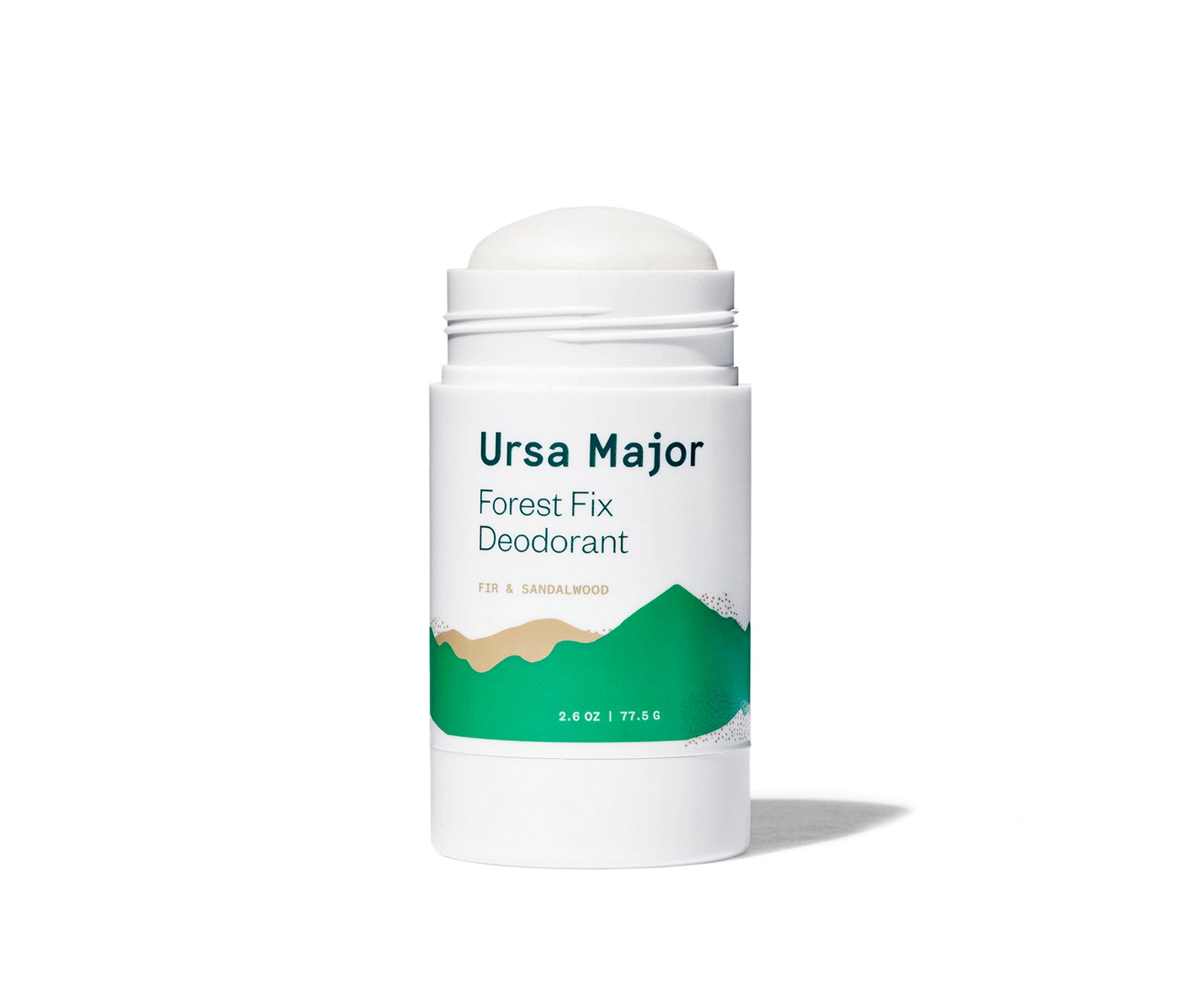 Open tube of Ursa Major Forest Fix Deodorant on a white background.  Tube is white with green lettering and green and tan mountains.