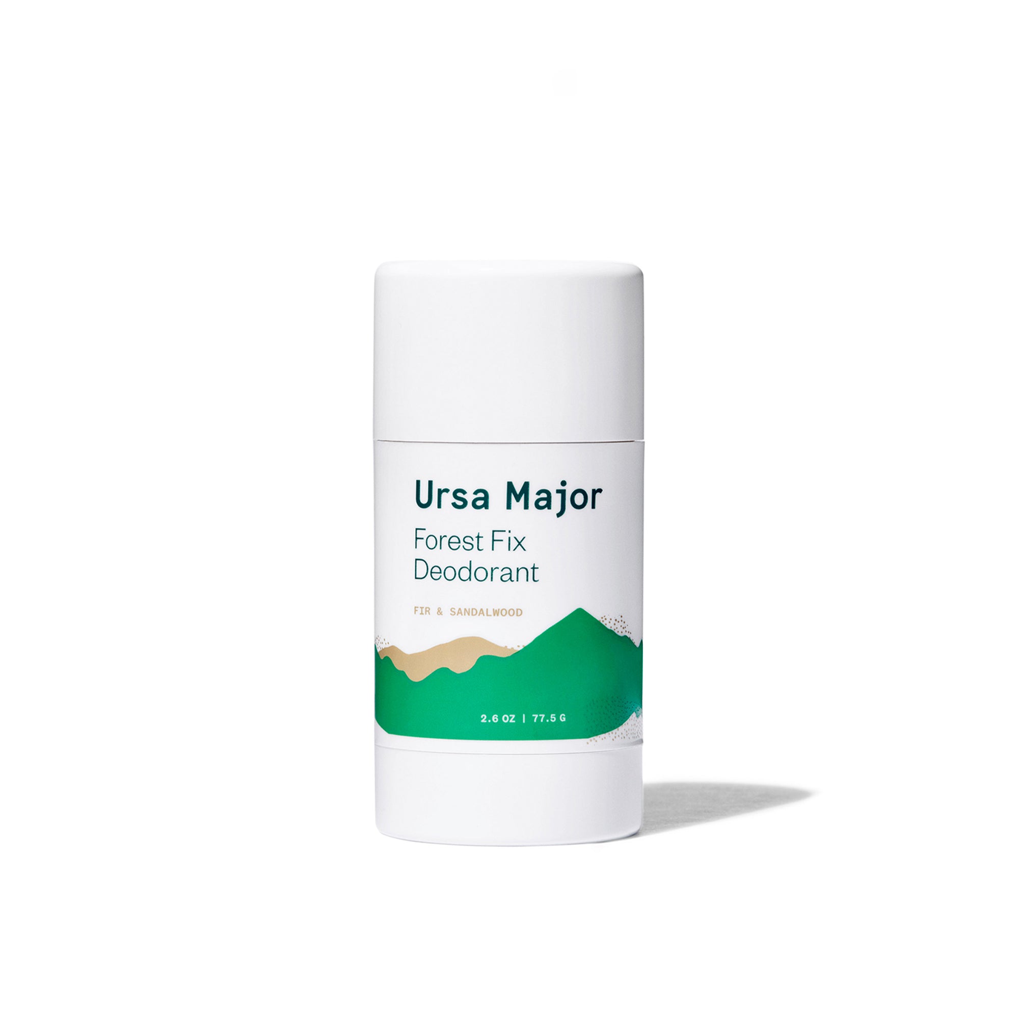 Ursa Major Forest Fix Deodorant on a white background.  Tube is white with green lettering and green and tan mountains.