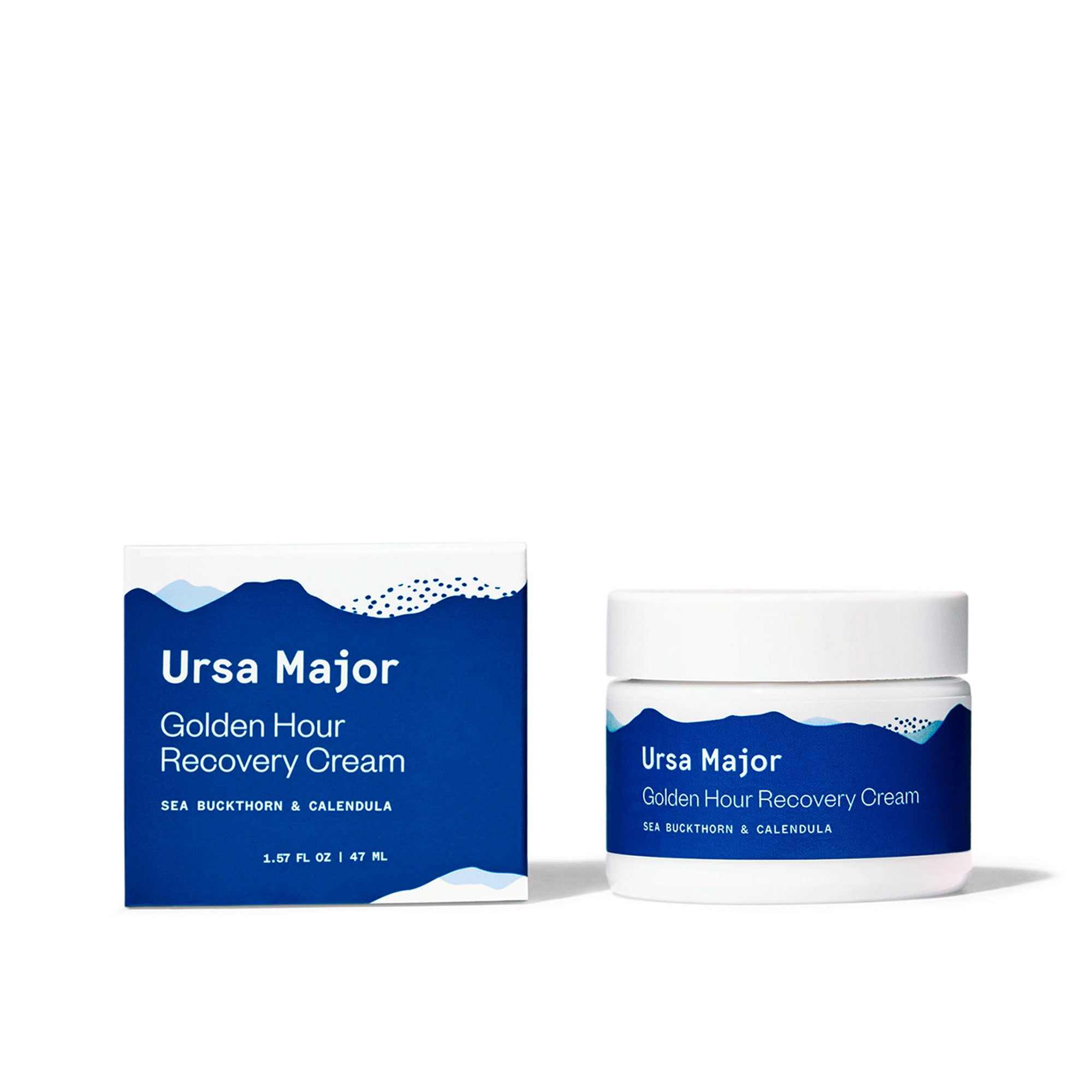 Box of Ursa Major Golden Hour recovery Cream next to the jar on a white background.  Both the box and jar are white with blue mountains on it.