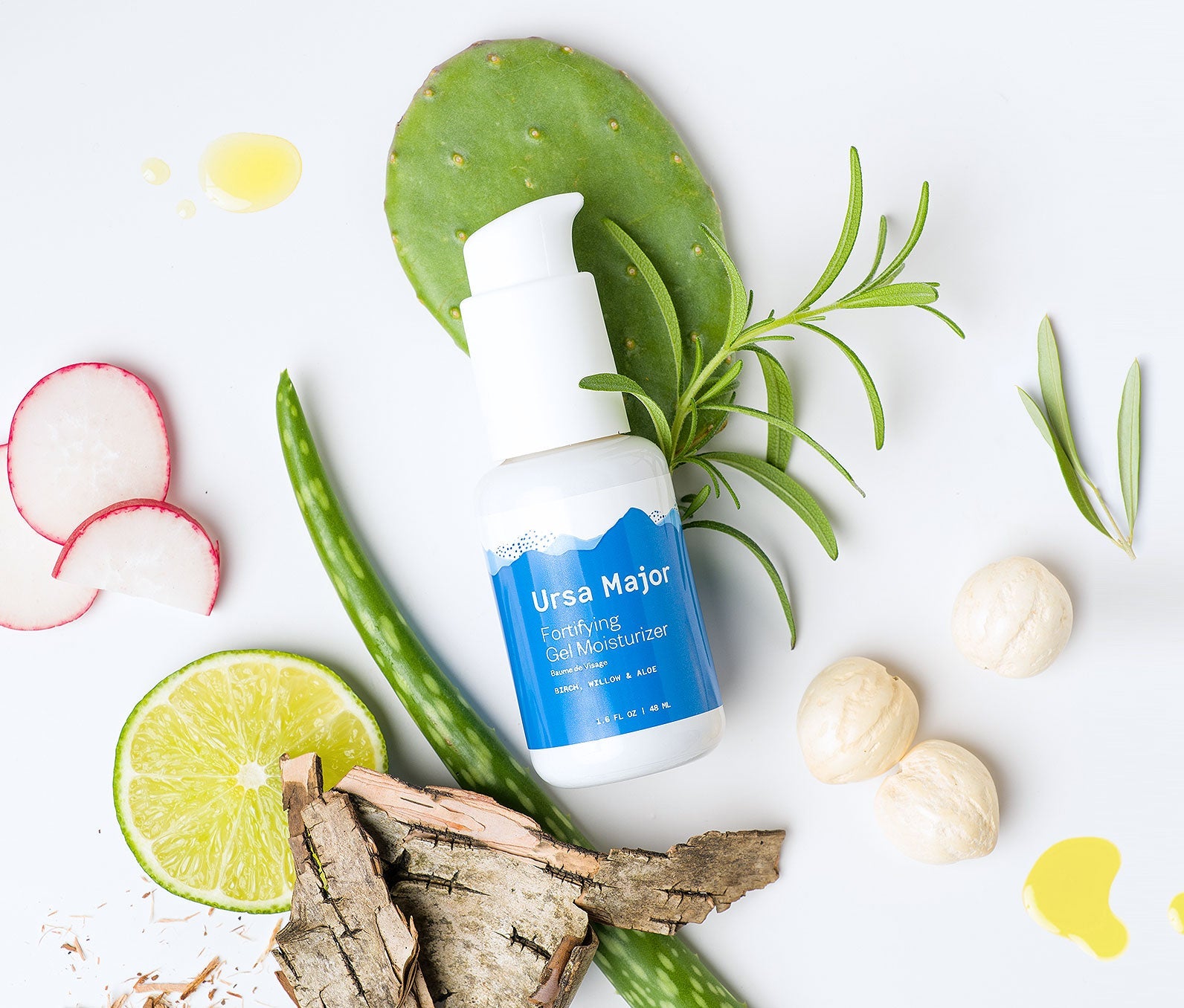 Ursa Major Fortifying Gel Moisturizer on a white background surrounded by some of the product's natural ingredients.