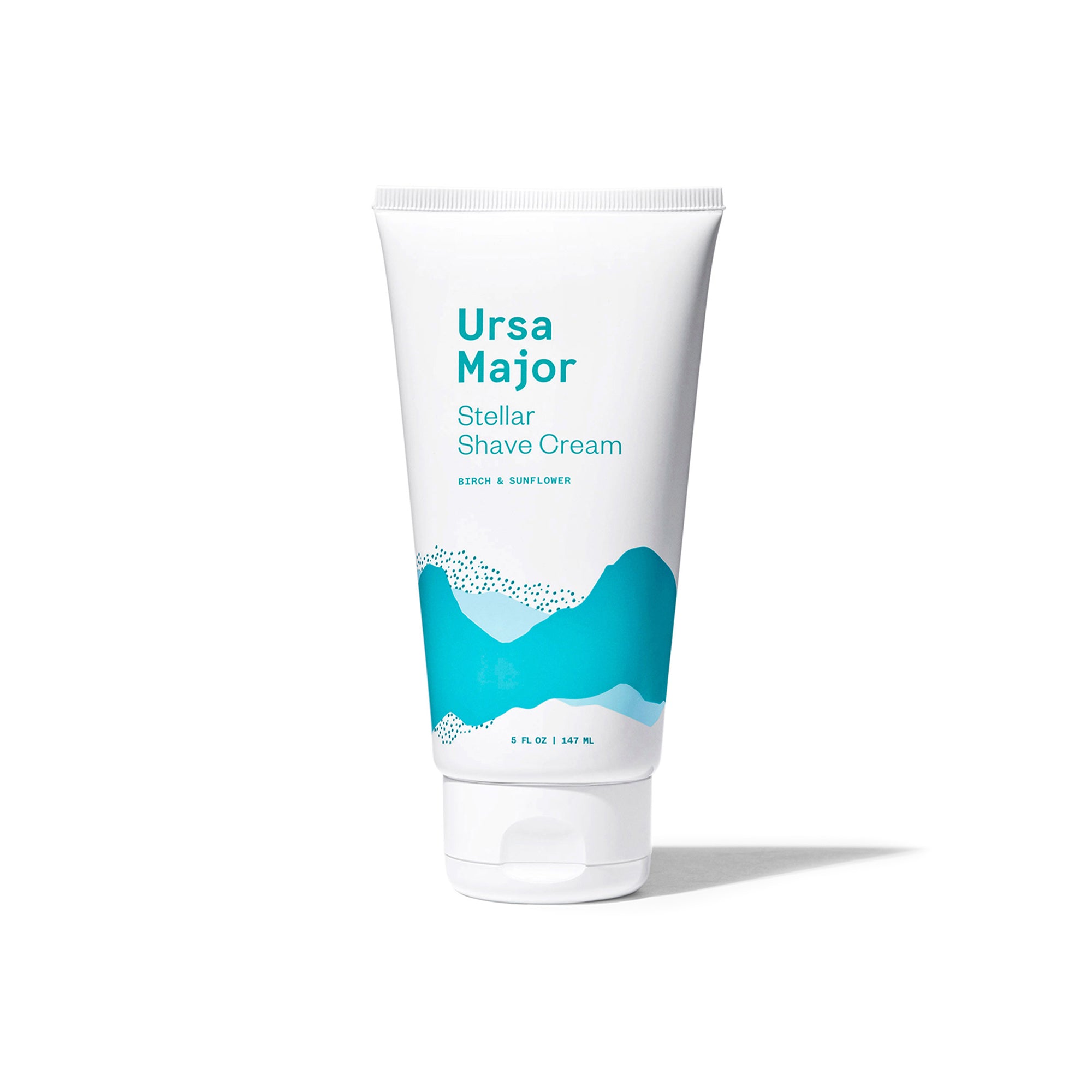 Ursa Major Stellar Shave Cream on a white background.  Tube is White with mountains in different shades of blue.