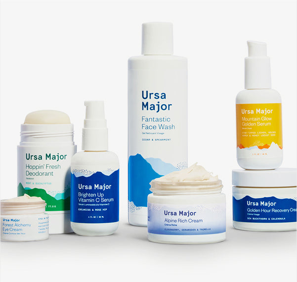 A series of Ursa Major Skincare products on a white background.  Products include Forest Alchemy eye cream, Hoppin' Fresh Deodorant, Brighten Up Vitamin C Serum, Fantastic Face Wash, Alpine Rich Cream, Mountain Glow Goden Serum, and Golden Hour Recovery Cream.